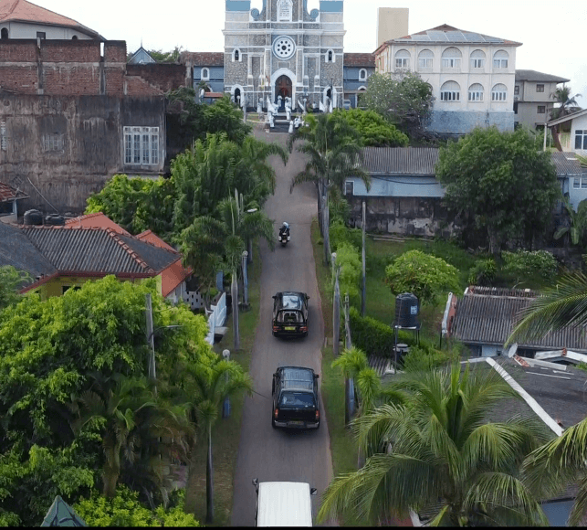 A man signing prepaid funeral plan documents